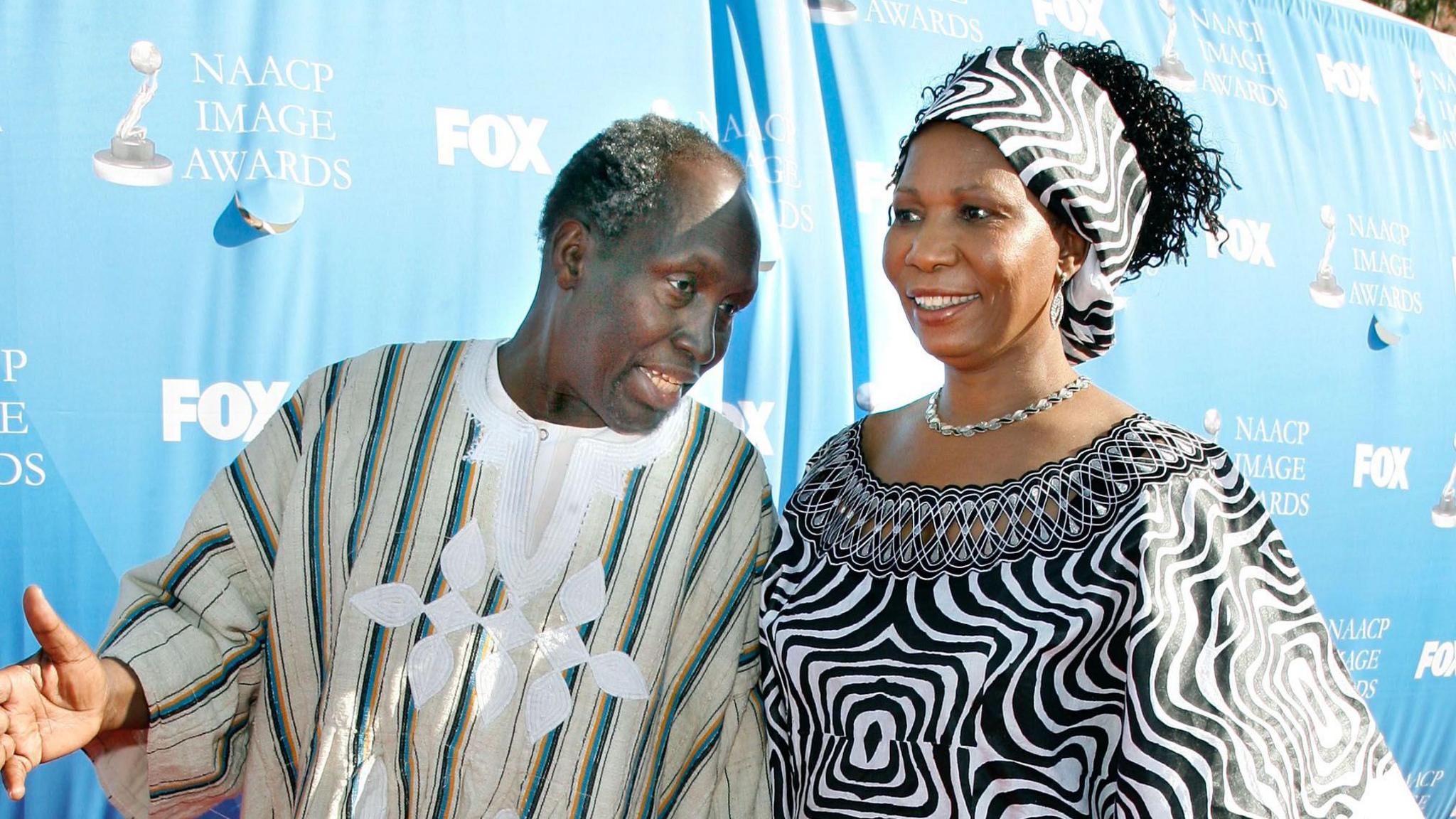 Writer Ngugi wa Thiong'o (L) and his wife arrive at the 38th annual NAACP Image Awards held at the Shrine Auditorium