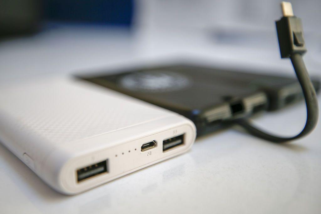 White and black portable chargers.